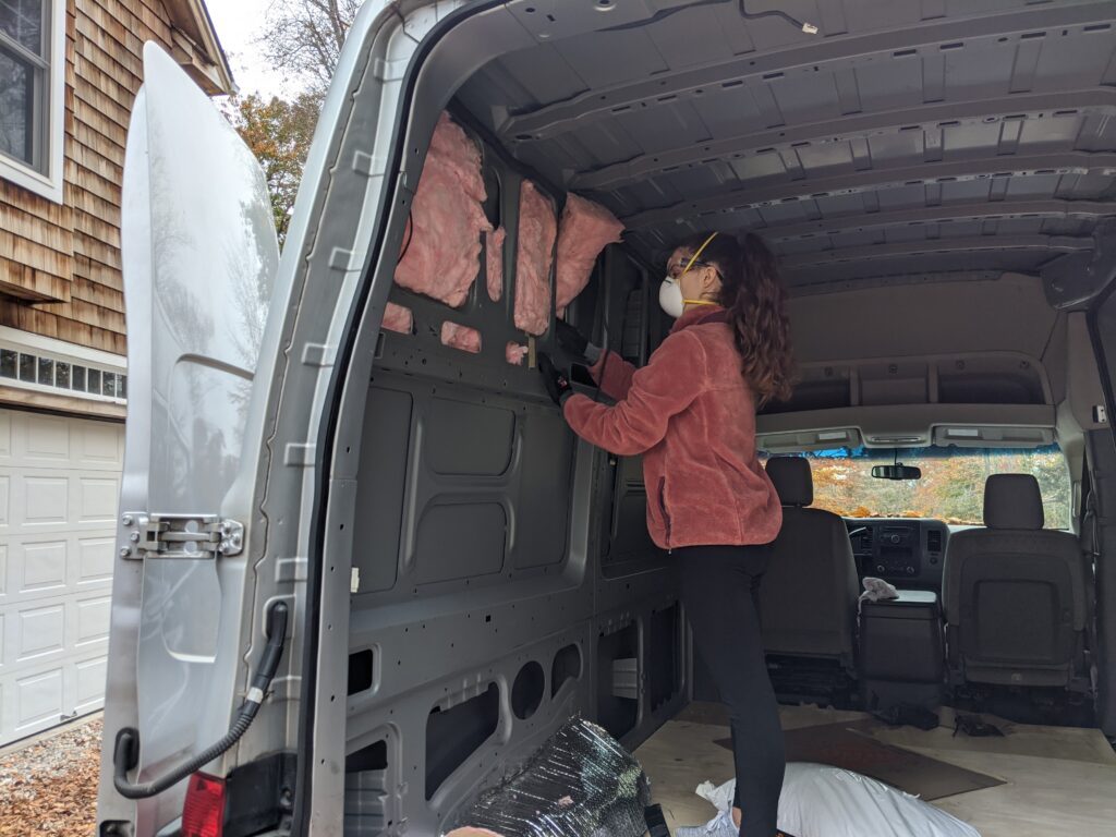 Woman Insulating camper van panels