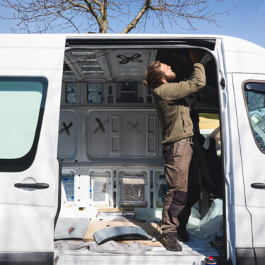 Man beginning work on his self made camper van