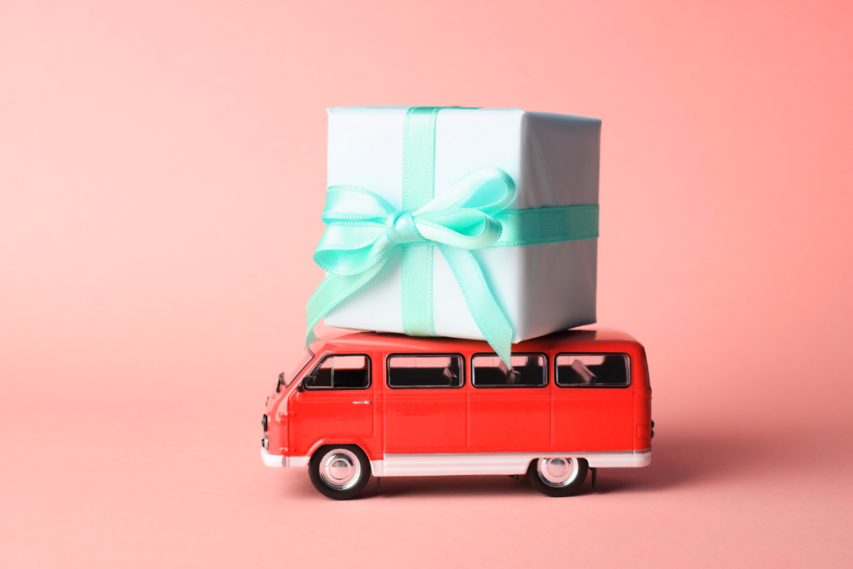 Miniature van with a gift box on top