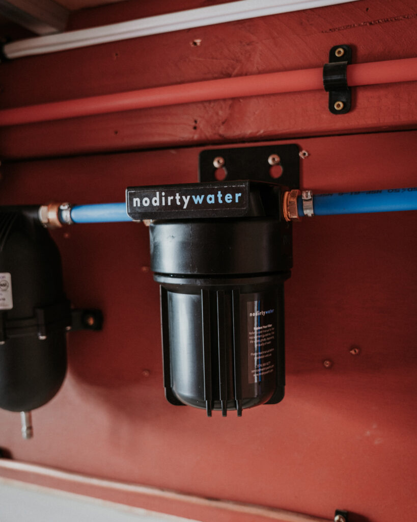 The No Dirty Water solo mounted in an RV water bay provides safe water.