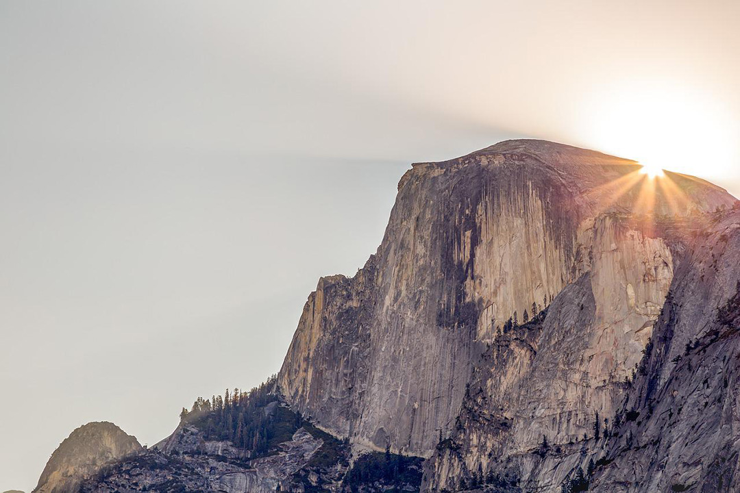 The sun setting behind Half Dome In Yosemite.