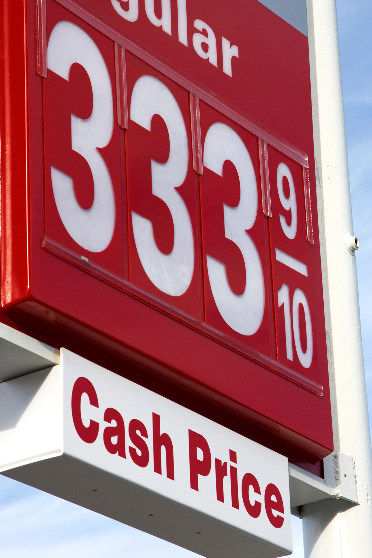 A gas station price sign that shows paying cash can save money on gas.
