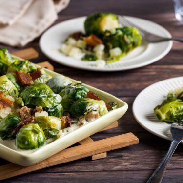 Dish of bourbon and bacon brussels sprouts with cream.