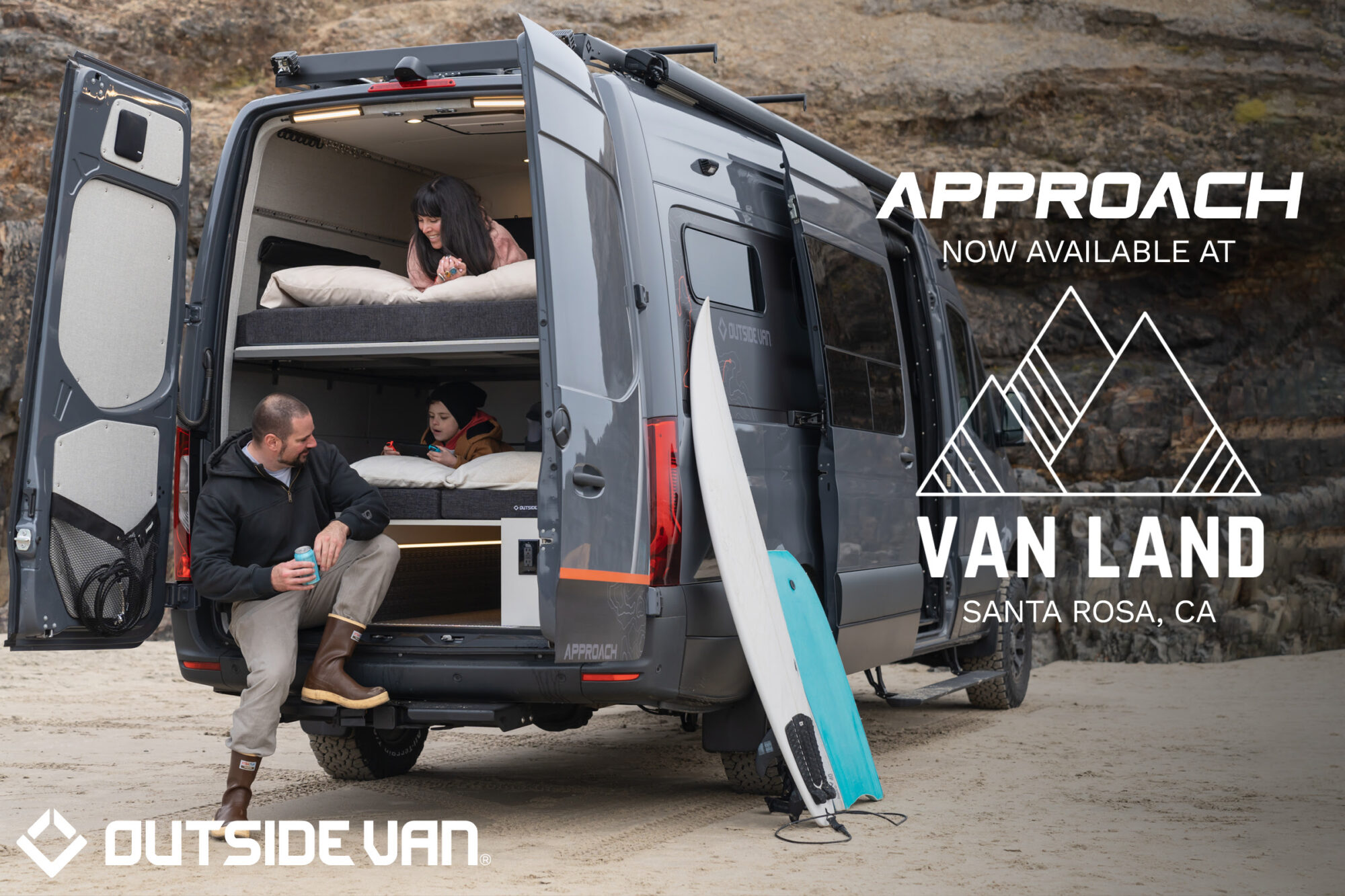 A couple and their child sitting in the Outside Van Approach model with the rear doors opened. Text overlay reads Approach Now Available at Van Land Santa Rosa, California
