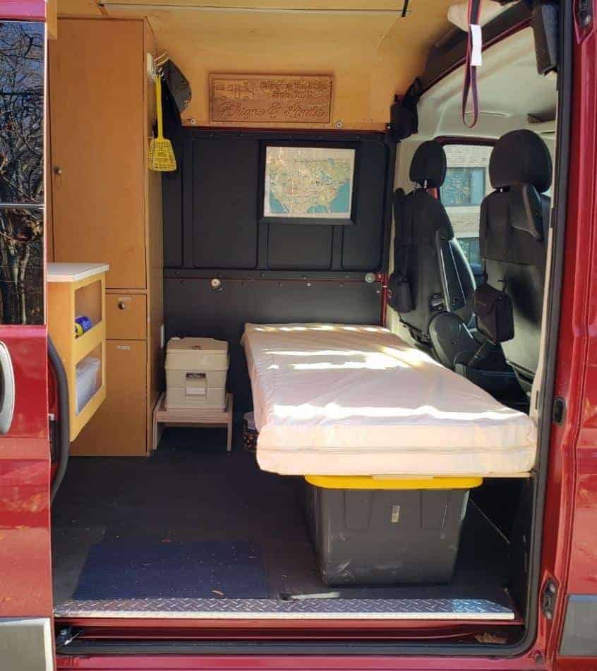 Forward area of van converted to a sleeping area.
